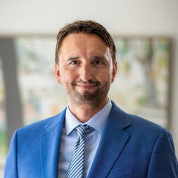 Dr. Adam Melski