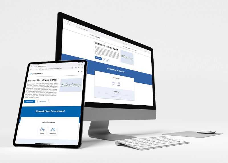 Zu sehen ist ein Desktop und ein Laptop auf dem eine Website geöffnet ist